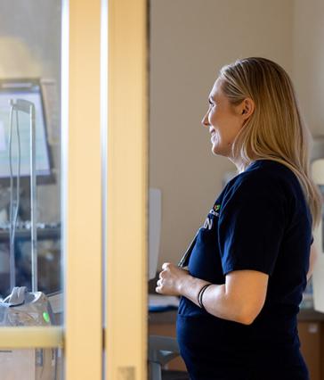 RN Kirsten Shumaker checks on a patient