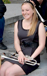 Esther Hood posing with her trumpet.