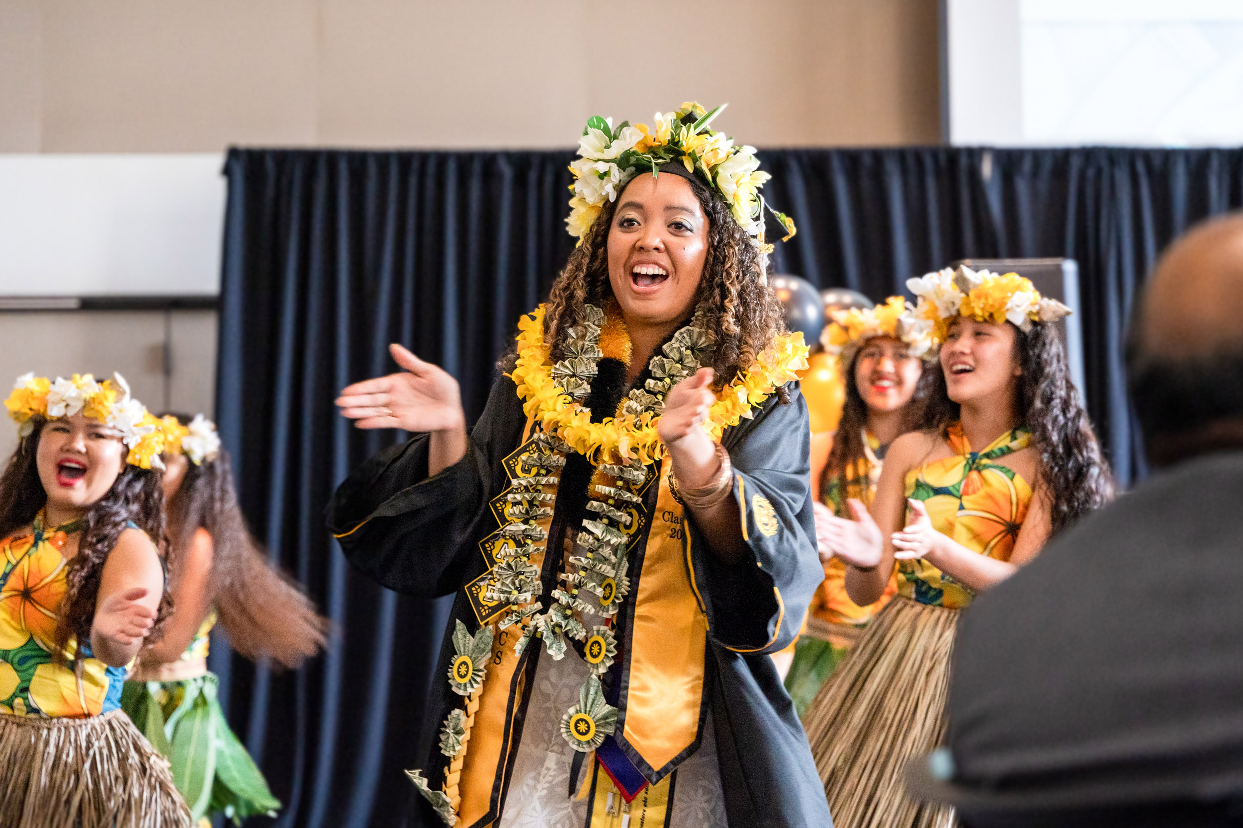 Pacific Islander graduate claps