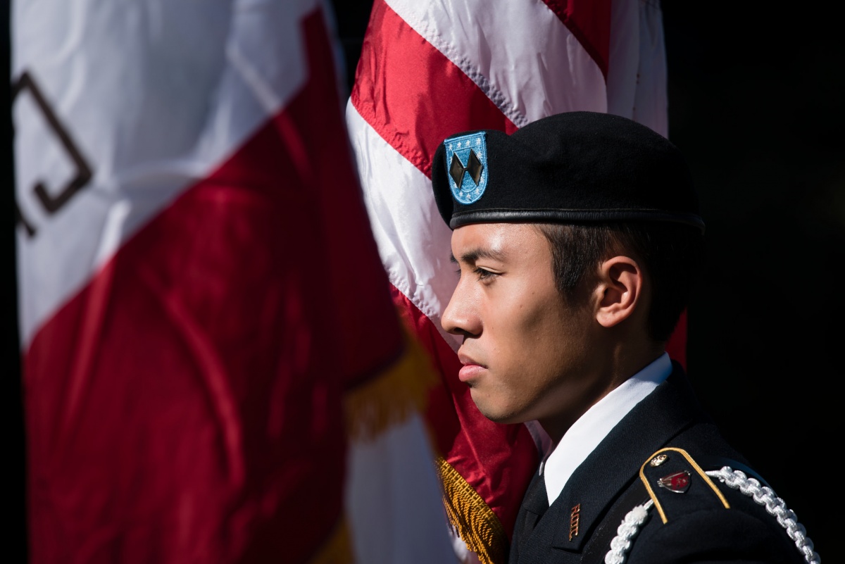 ROTC member in front of flag