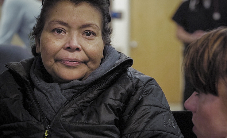 screen shot - older hispanic woman in the clinic