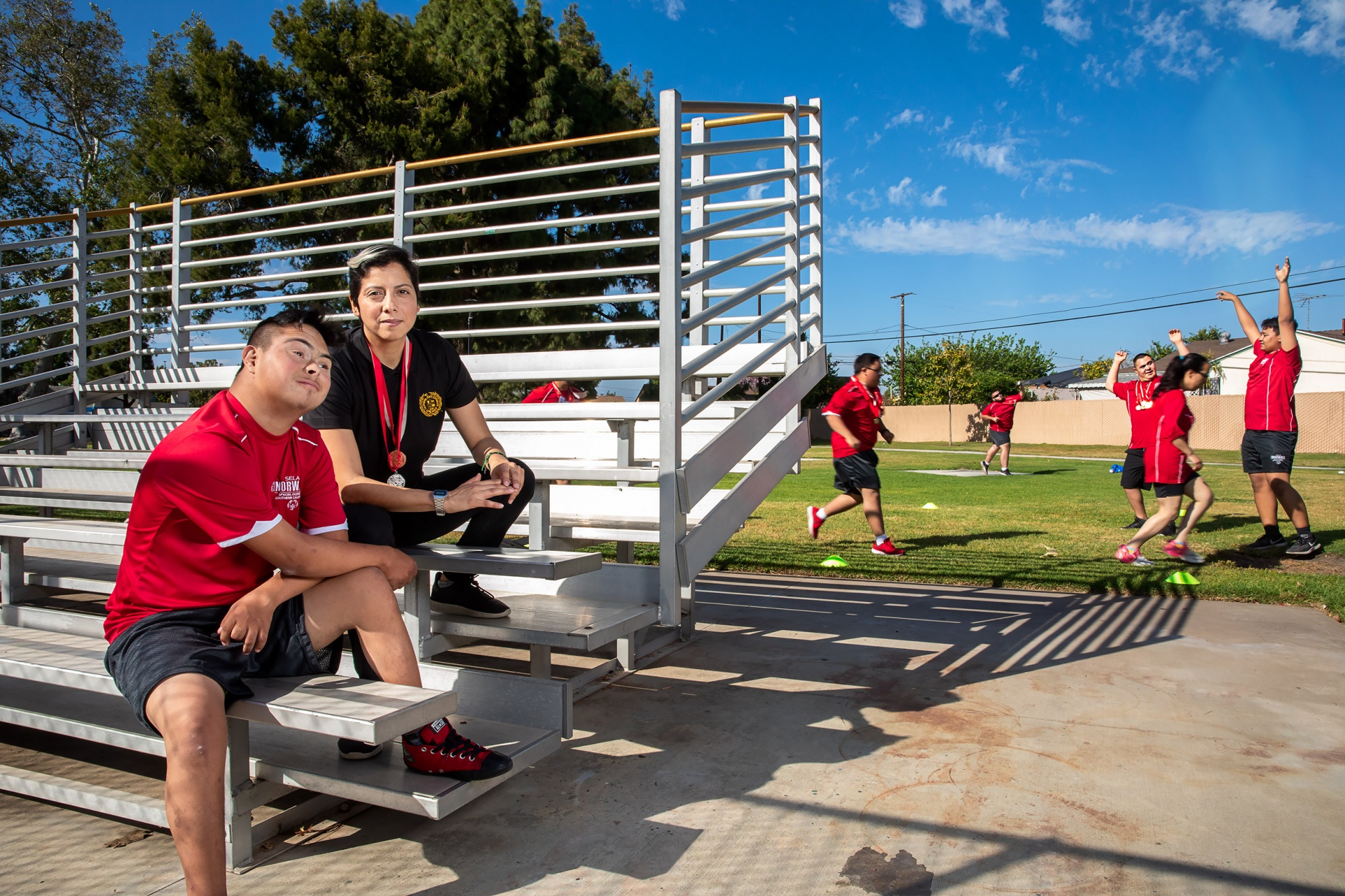 veronica_jaramillo.jpg Group of Special Olympics athletes sitting for portrait.