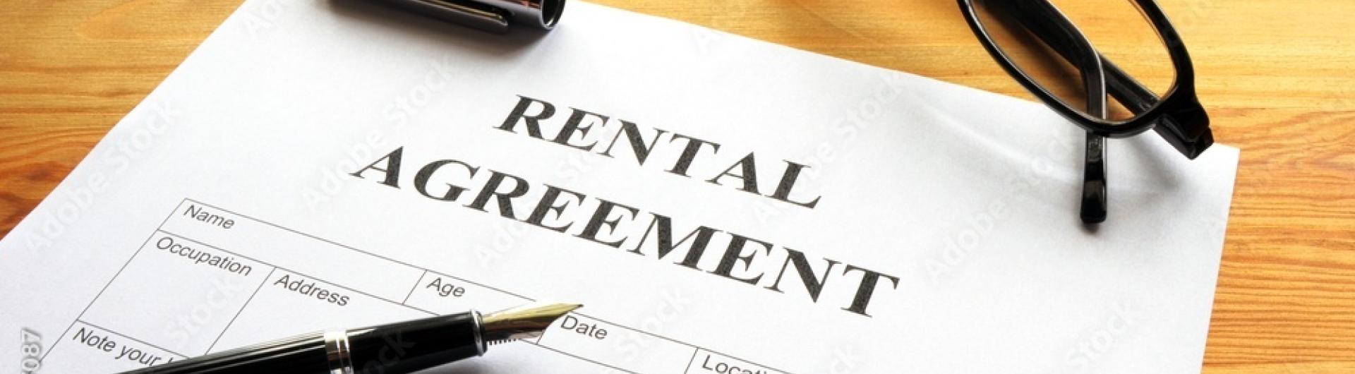 rental agreement and pen for signature