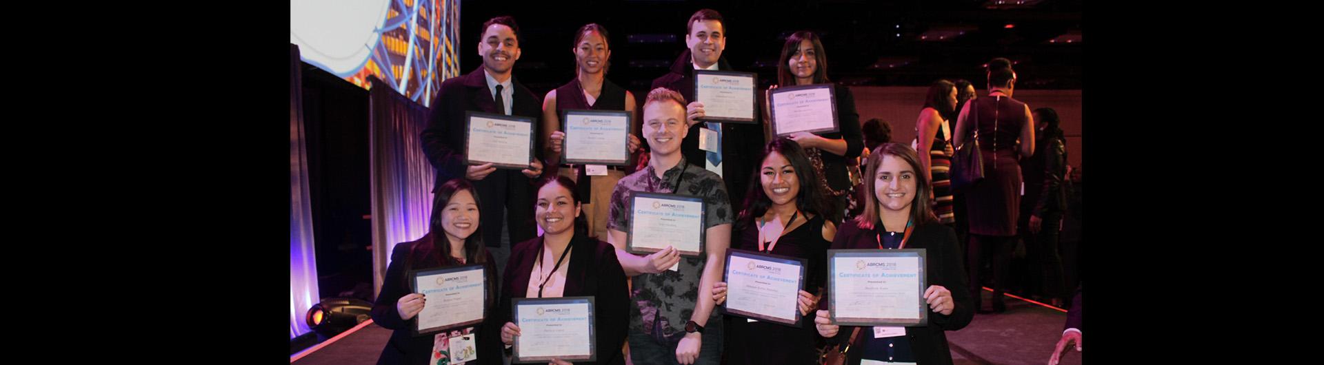 CSULB students holding up ABRCMS 2018 awards