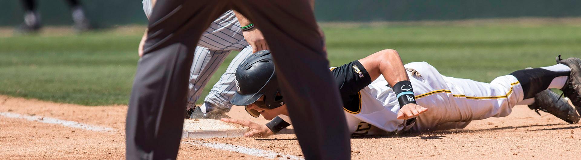 Dirtbags player slides into home