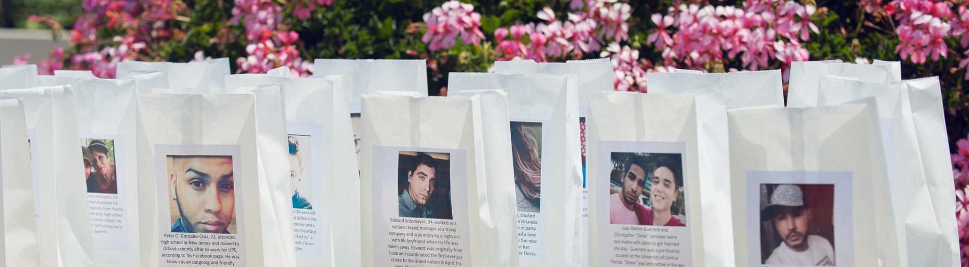 The faces of the victims on luminary bags for the vigil. 