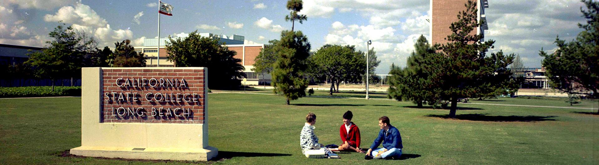 1960's campus image, students on the lawn