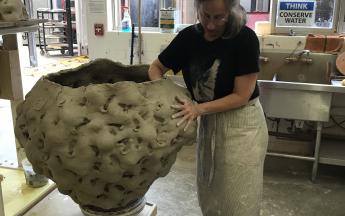 Artist in residence Donna Green working on large wheel-thrown and altered forms, 2019.