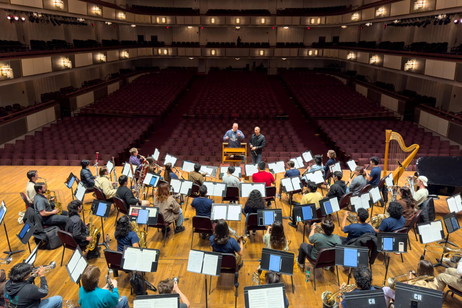 COTA Dean Royce W. Smith conducts the Wind Symphony during rehearsals