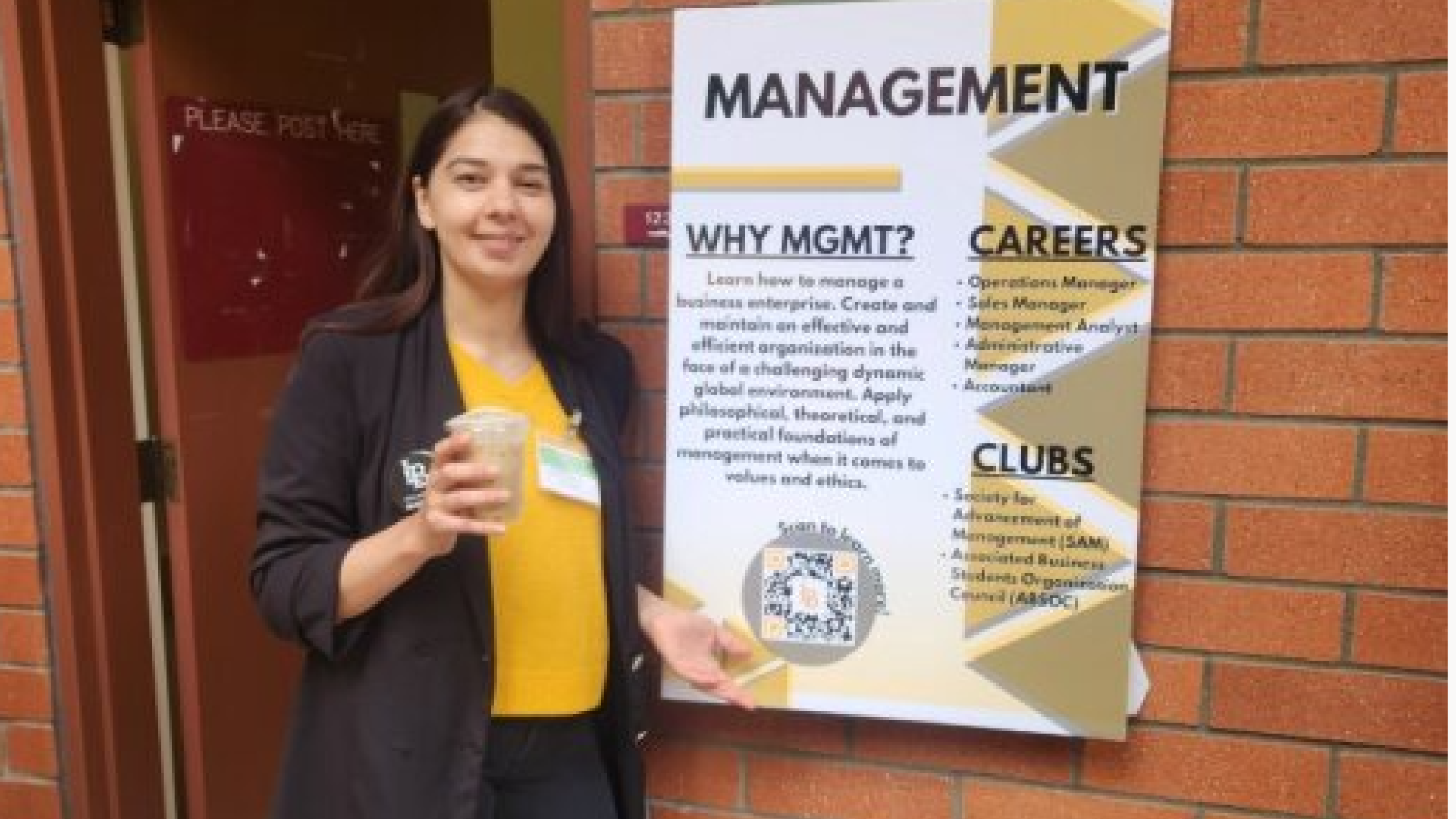 Management Administrative Support Coordinator Edilu Medina welcome prospective students to the Management Showcase