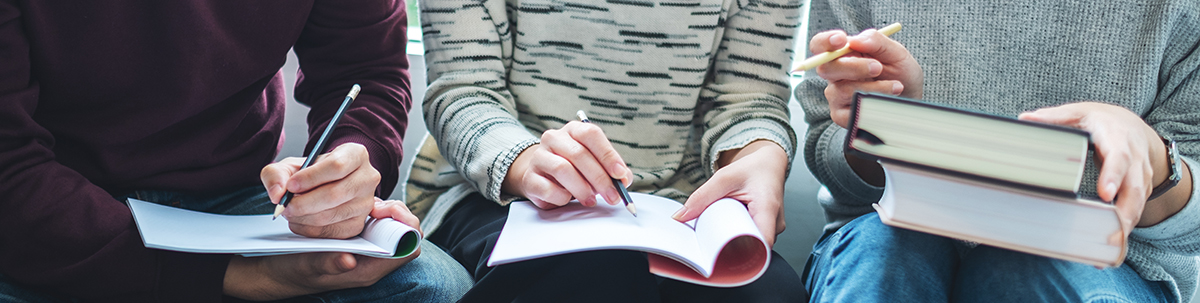 students writing on paper