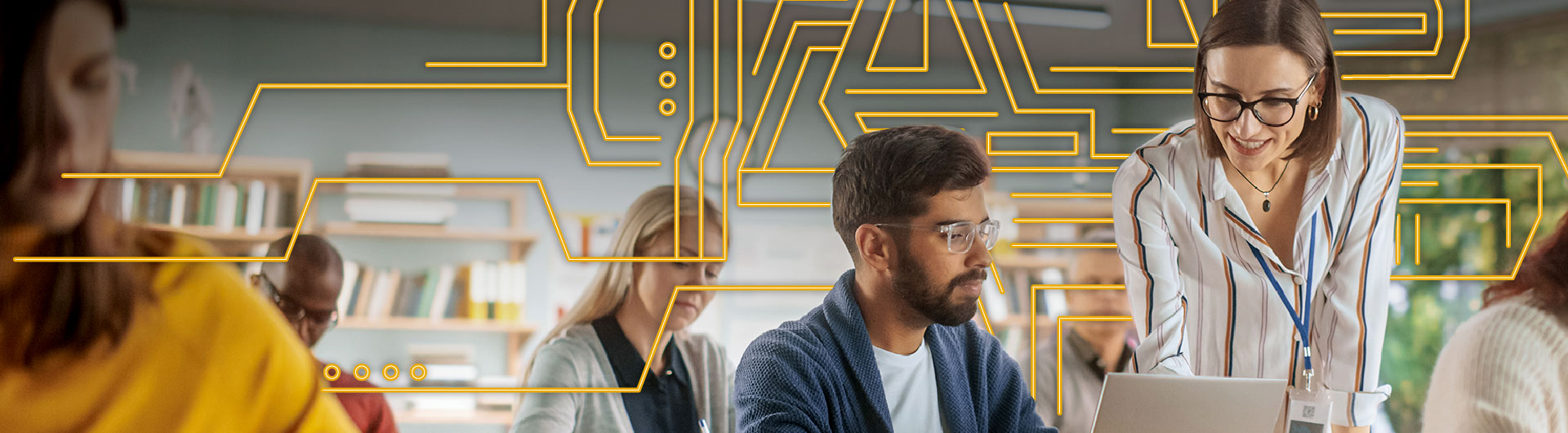 Standing instructor teaching seated student, yellow lines in background