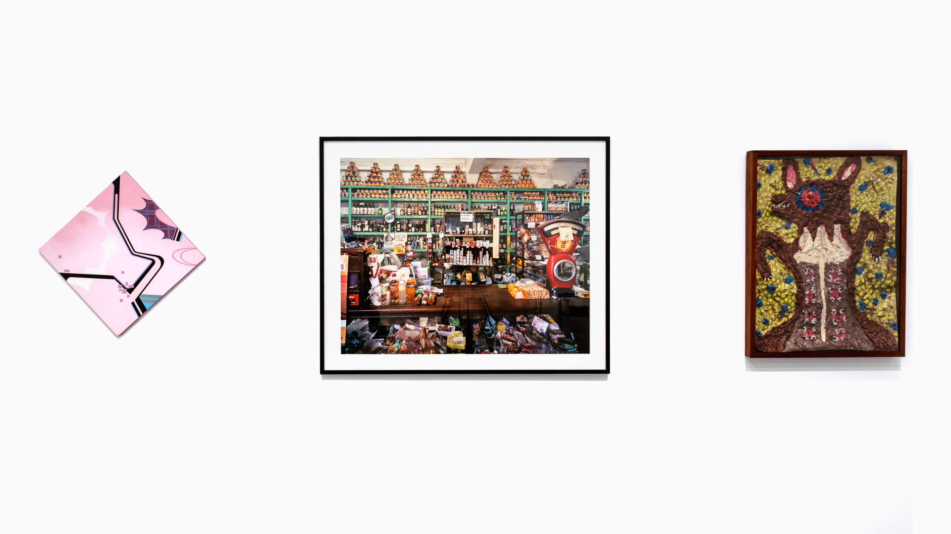 Photo of multiple artworks on gallery wall