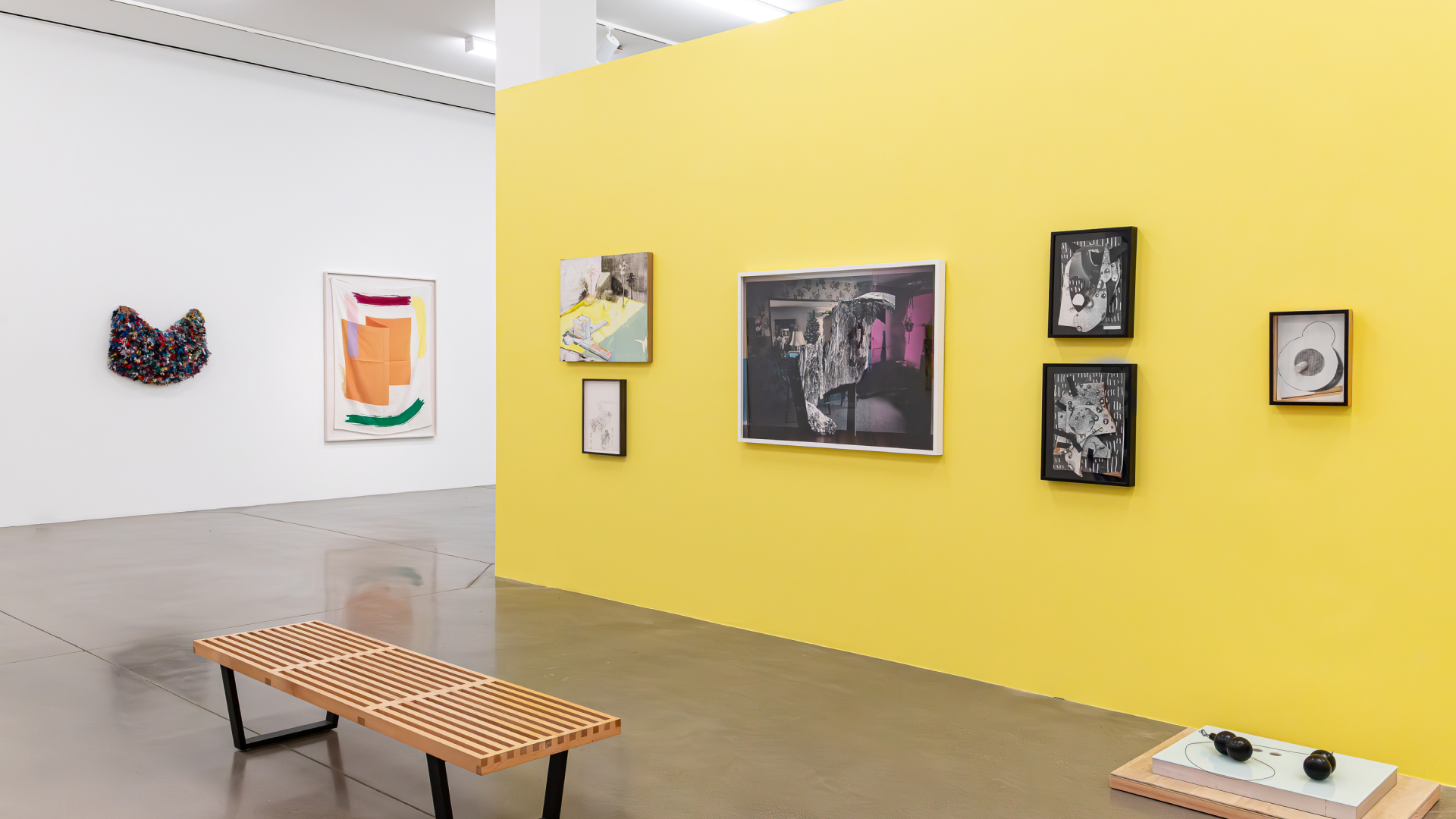 Multiple art pieces shown in the university art museum