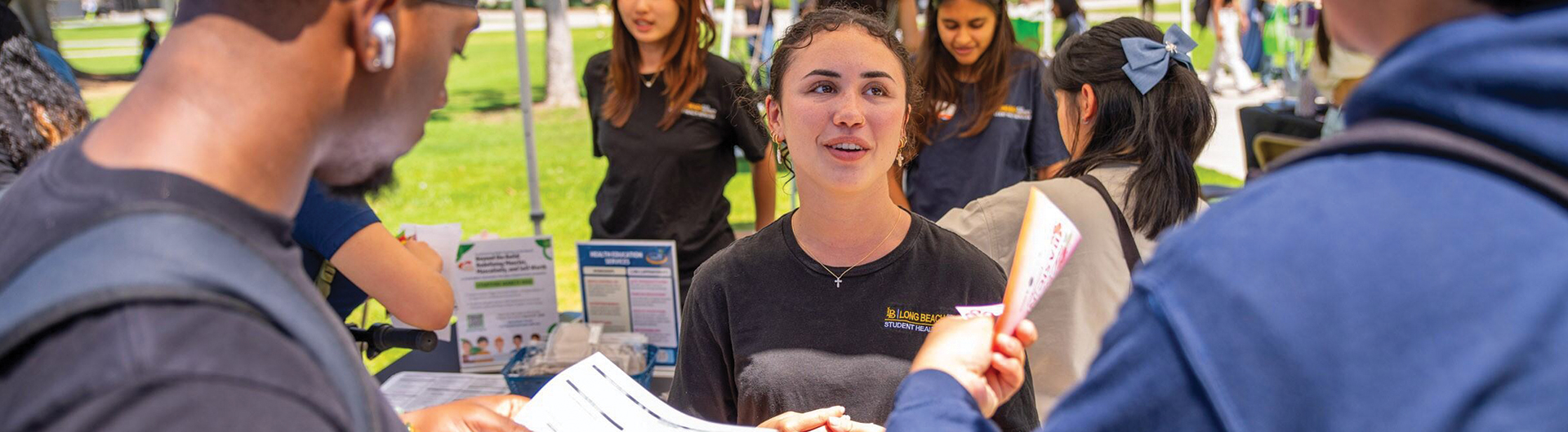 A student talks to others about financial wellness