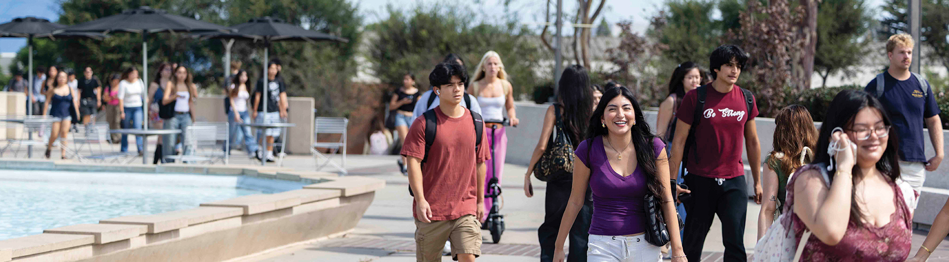 Students walking near the fountain