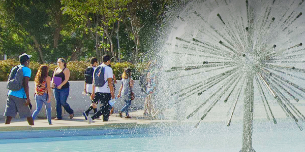 Students walking on the CSULB campus by the Brotman Fountains