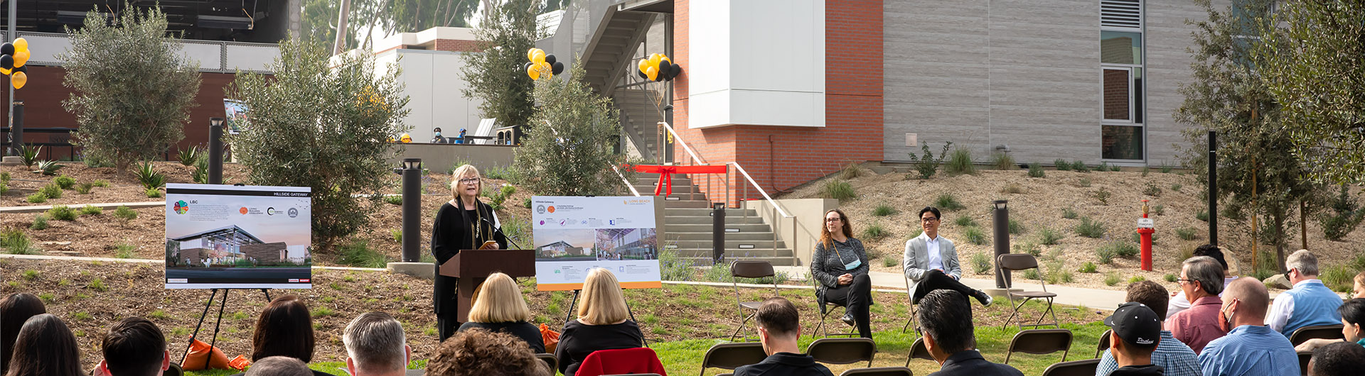 CSULB officials gather in front of new housing area