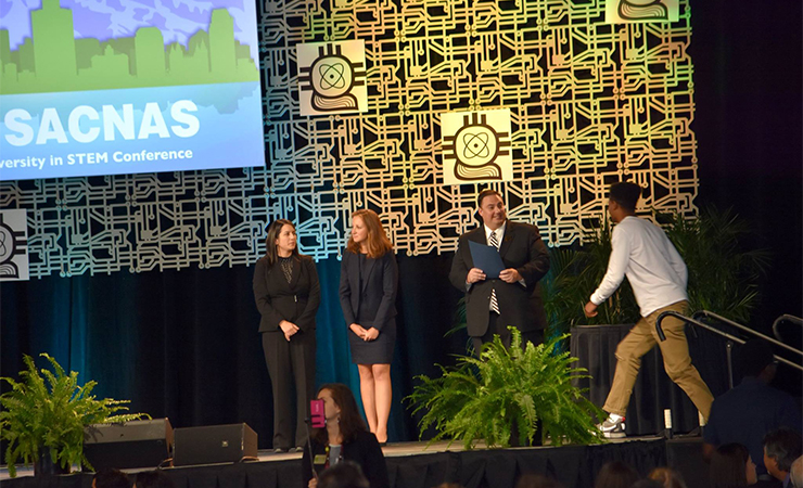 02-dejuantewalker.jpg Dejuante Walker goes on stage to accept his award.