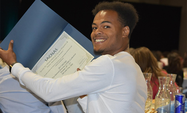 Dejuante Walker shows off his award.