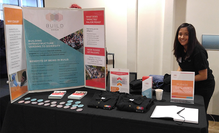 Vista Volunteer Kimberly Torres setting up the BUILD display