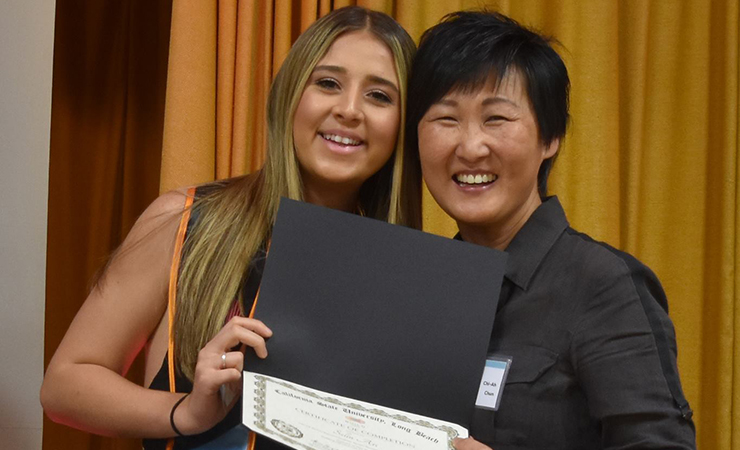 14-selin-ari-receives-certificate.jpg BUILD Scholar Selin Ari receives her certificate from Dr. Ch
