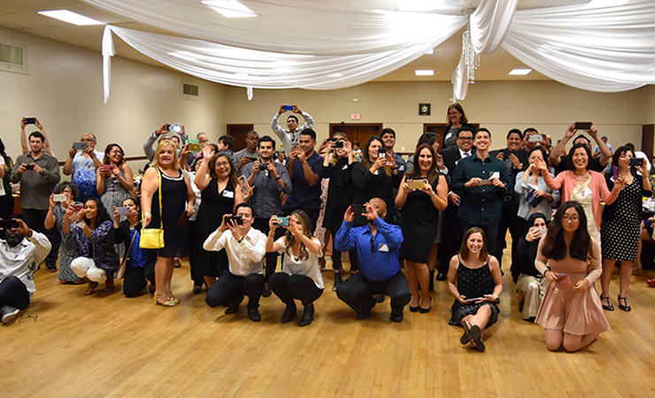 16-taking-pics.jpg Family and friends snap pictures of the Scholars like papara