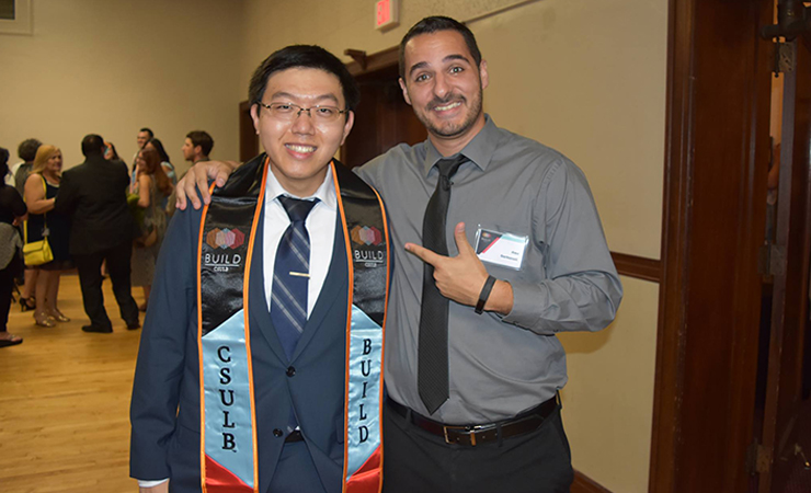 17-author-yai-alex-garbanati.jpg BUILD Scholar Author Yao shows off the BUILD sash BUILD Grap