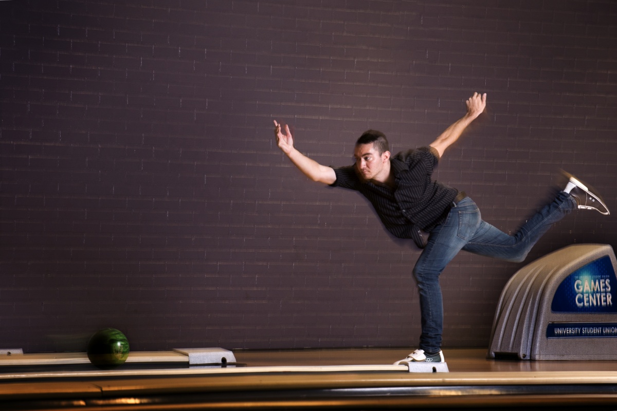 Male student bowling 