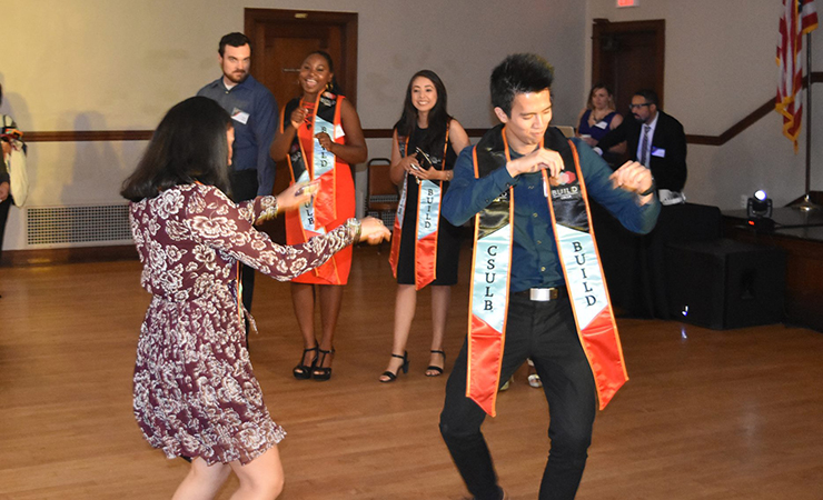BUILD Scholar Huong Dang gets down while other scholars chee