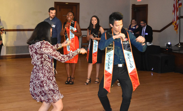 20-huong-dang-getting-down.jpg BUILD Scholar Huong Dang gets down while other scholars chee