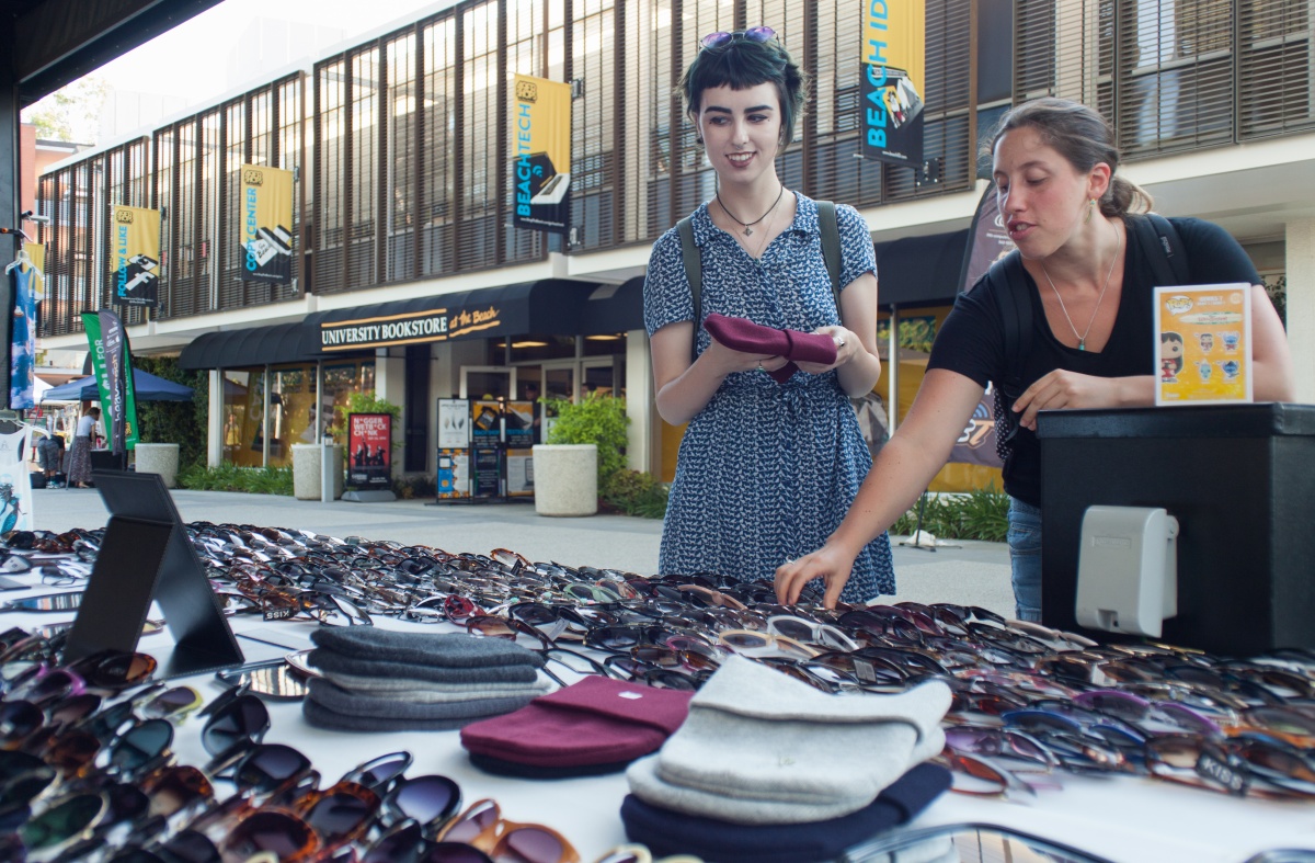 Students shopping at a pop up shop outside of the bookstore