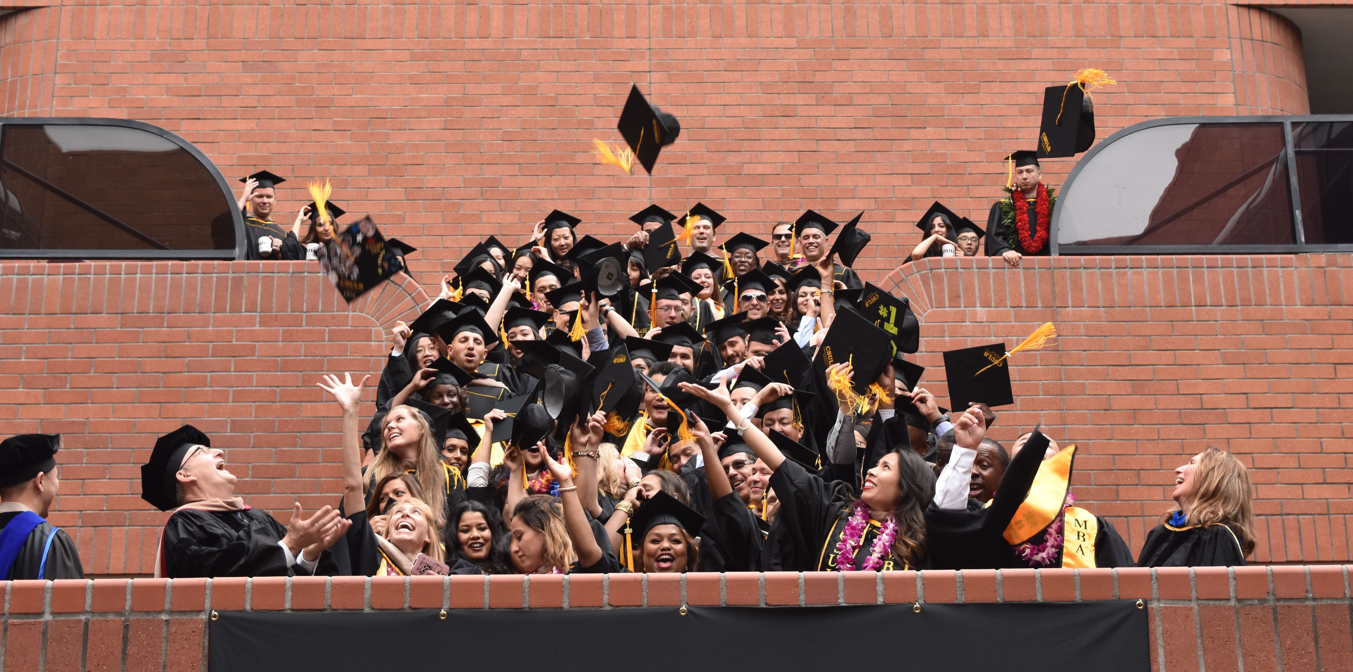 2016.hooding.jpg students graduation