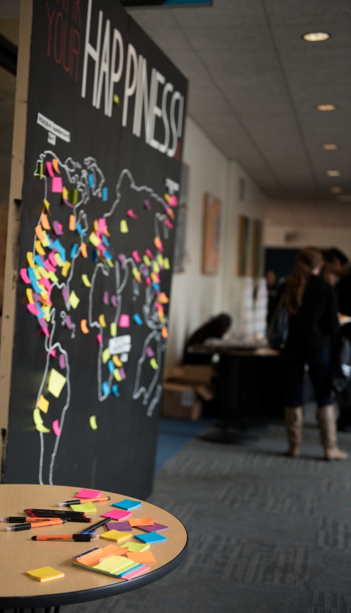 Attendees placed post its explaining what happiness means to