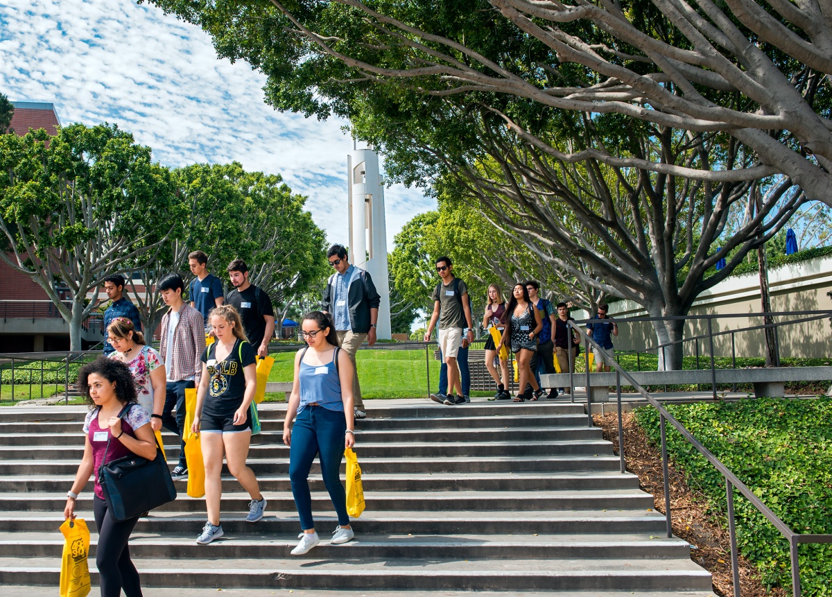 SOAR students tour the campus, bags in tow. 