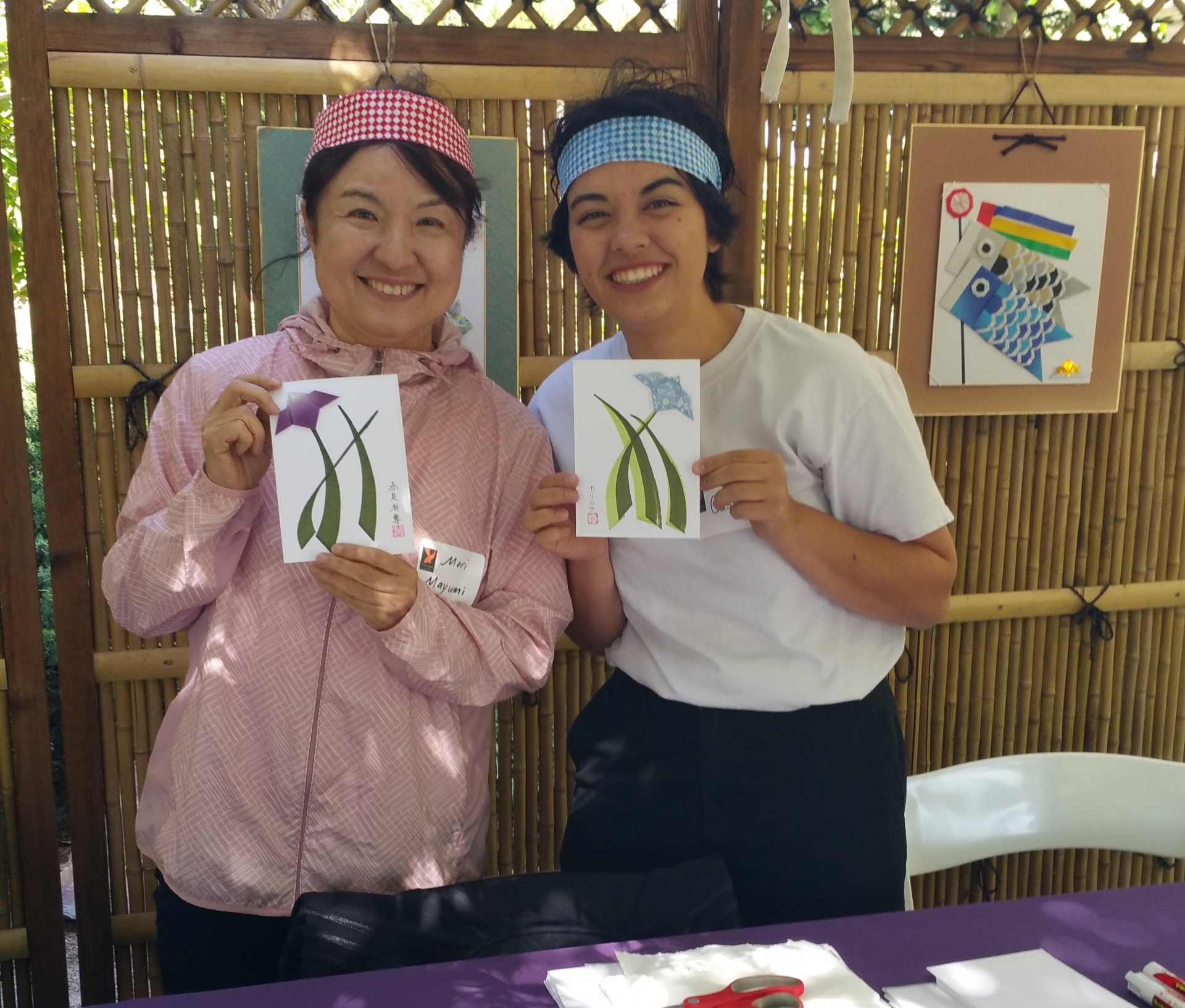 A doocent and a volunteer at a Garden event