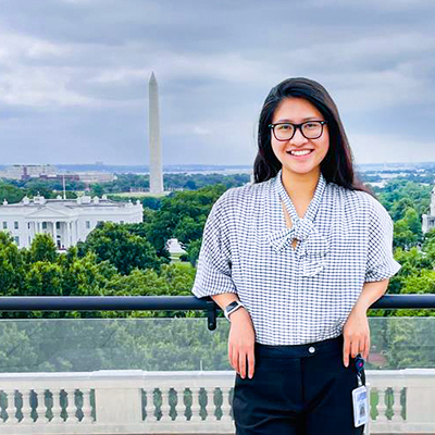 Student Kieu Anh Vu standing on balcony in Washington