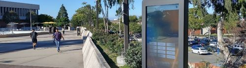 Outdoor picture showing a campus directory touchscreen located near Maxson Plaza.