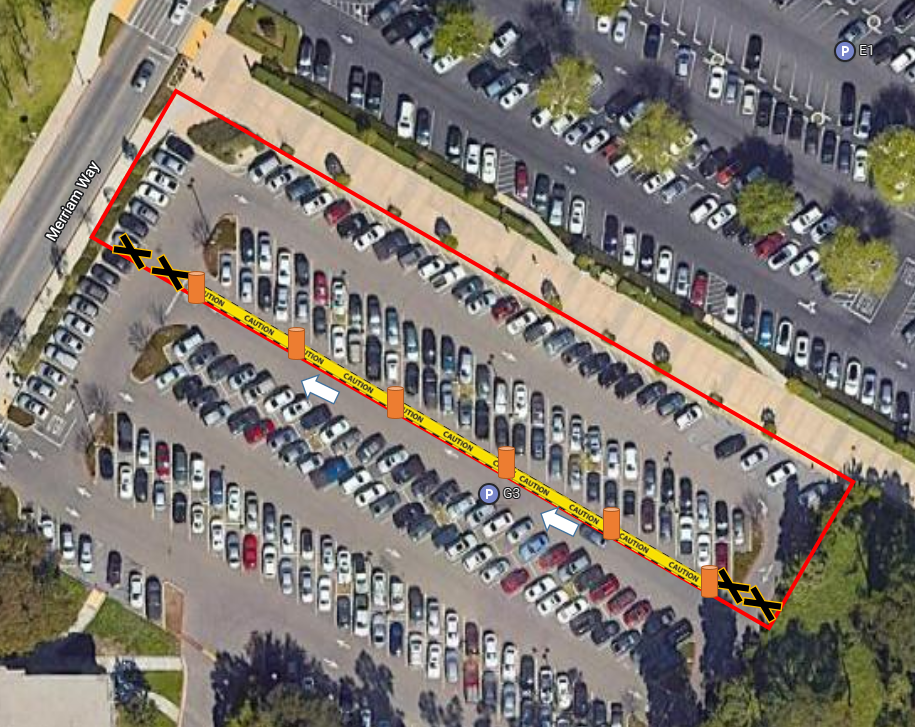 Parking lot with barricaded area labeled