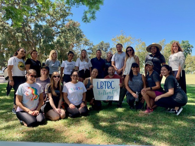 Students pose at a Long Beach Trauma Recovery Center retreat