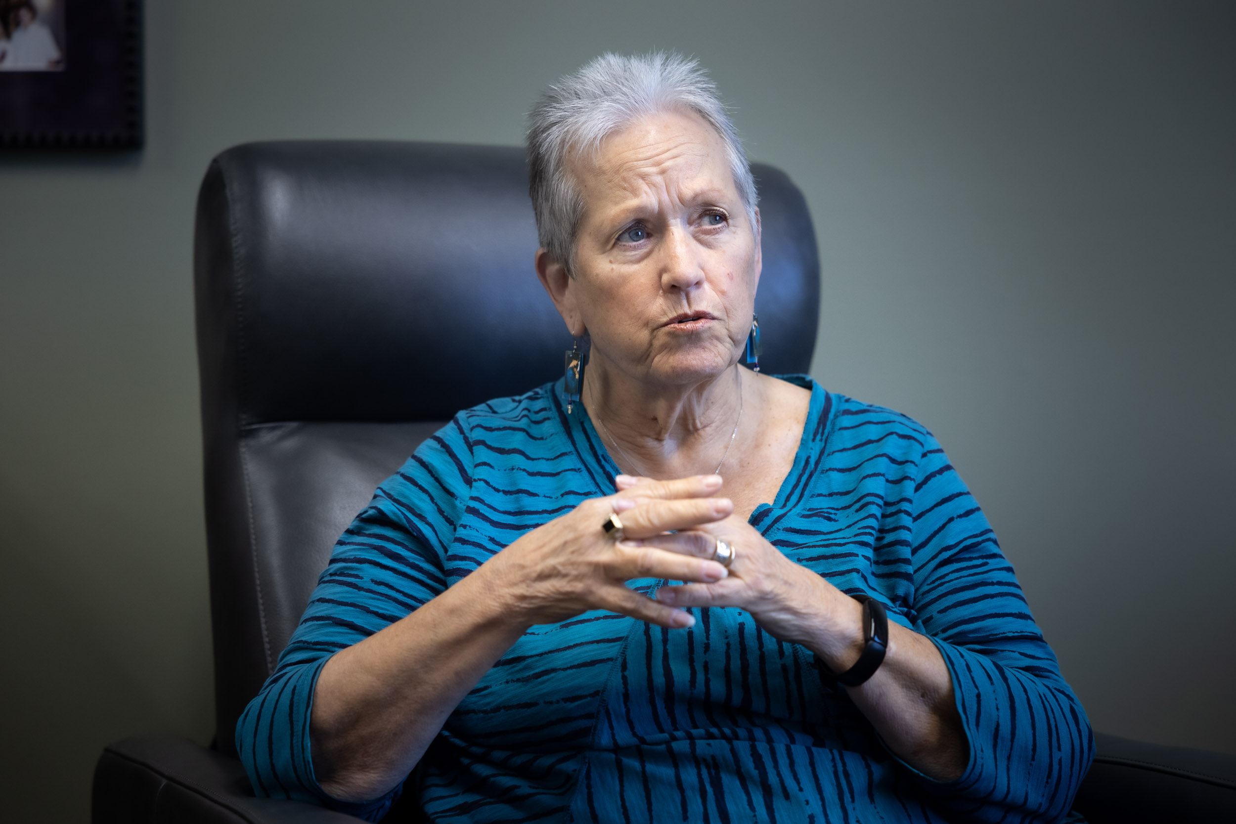 Alyce LaViolette sits and holds hands together