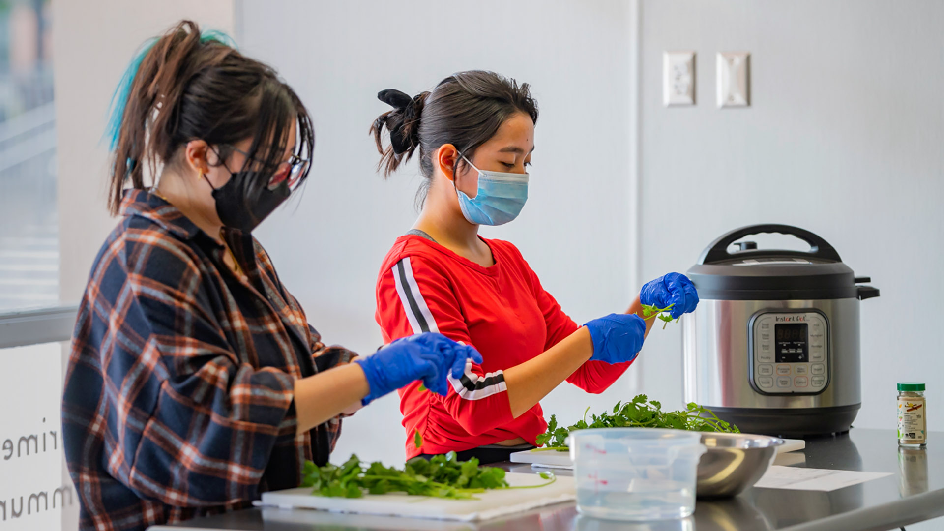 Students prepare food in Beach Kitchen