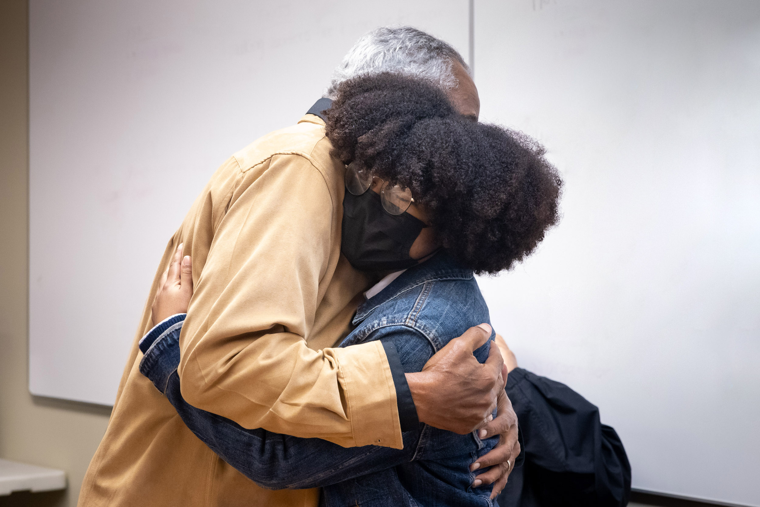 Veteran Charles Smart hugs artist Nyah Bester