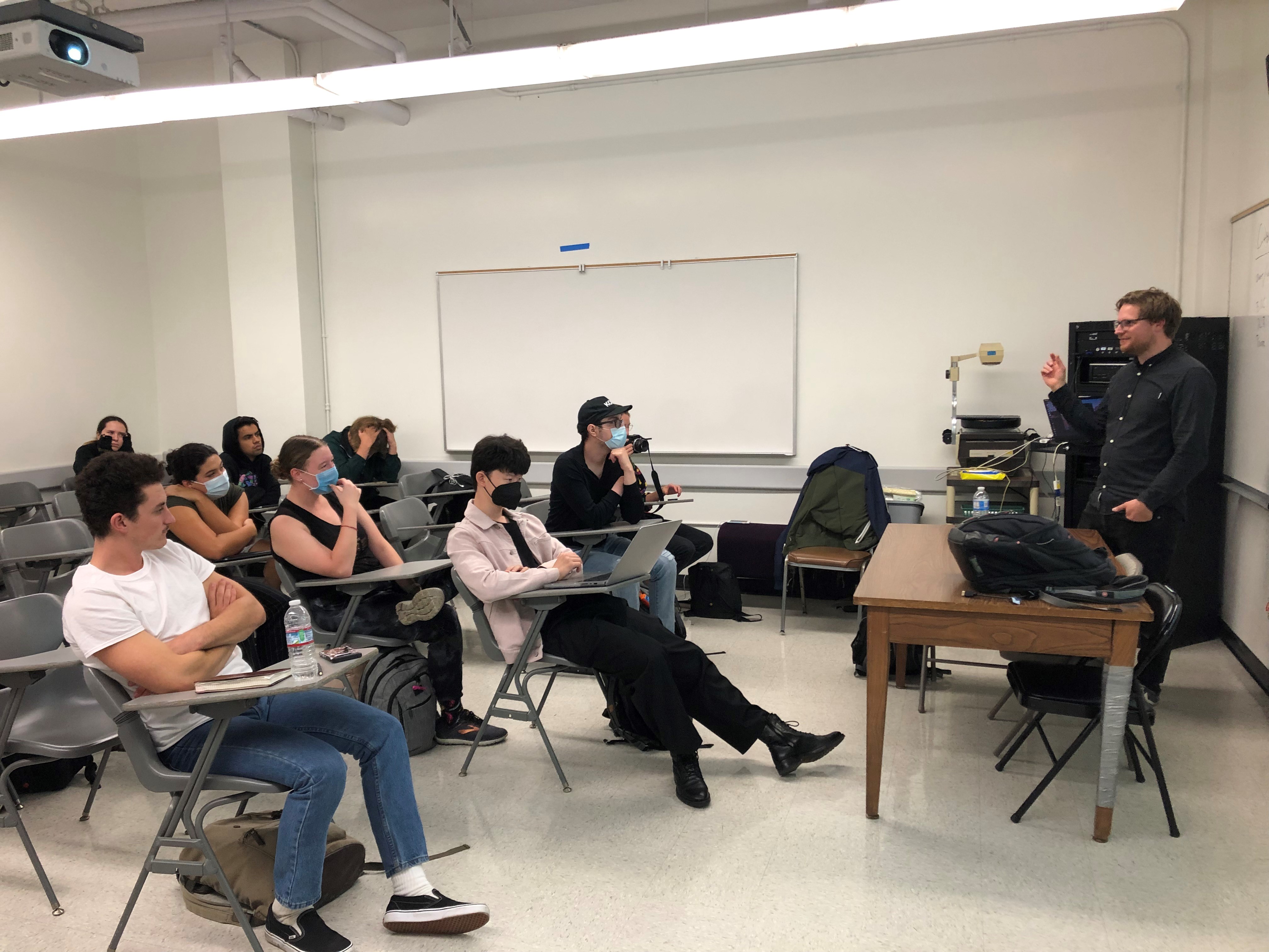 Students in classroom sitting listening to presentation