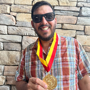 man holding medal