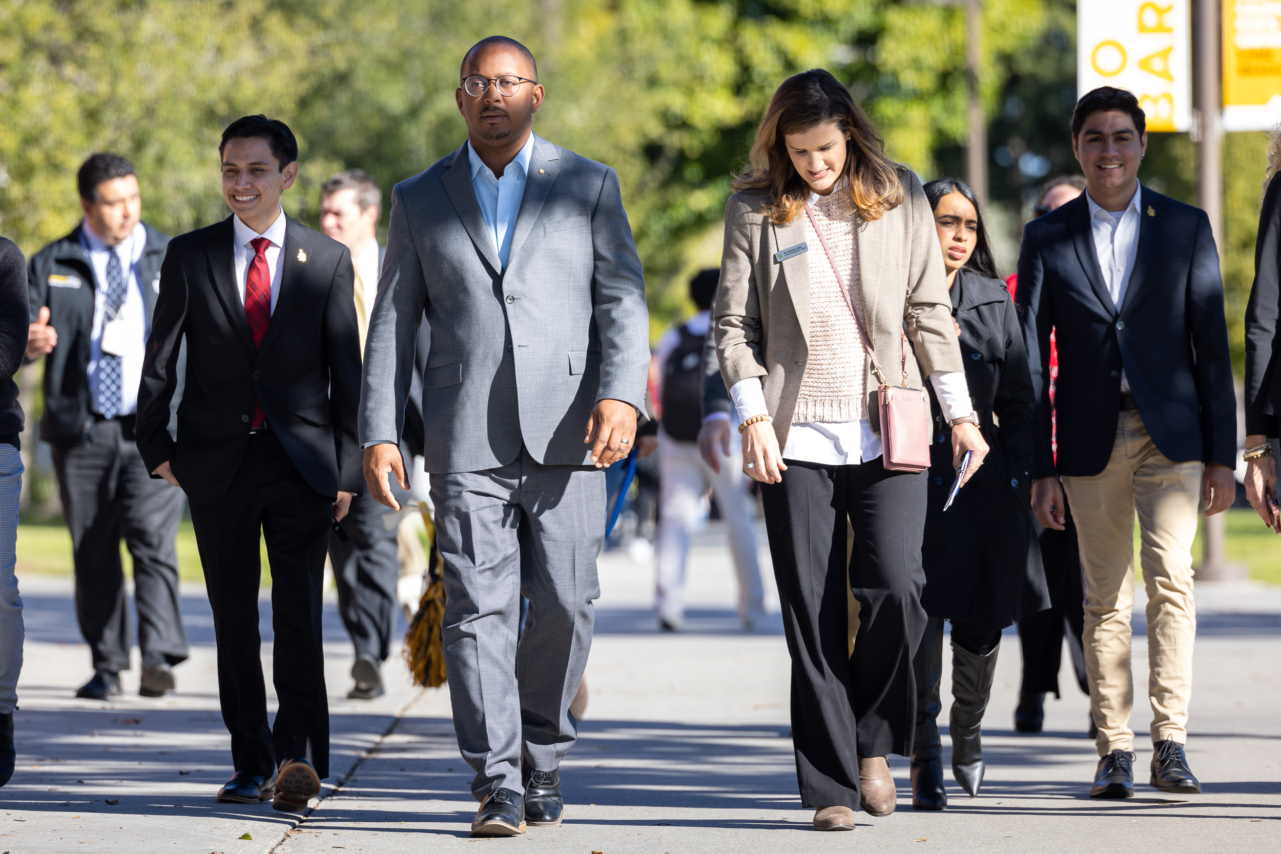 Mayor Rex Richardson walks across campus with students
