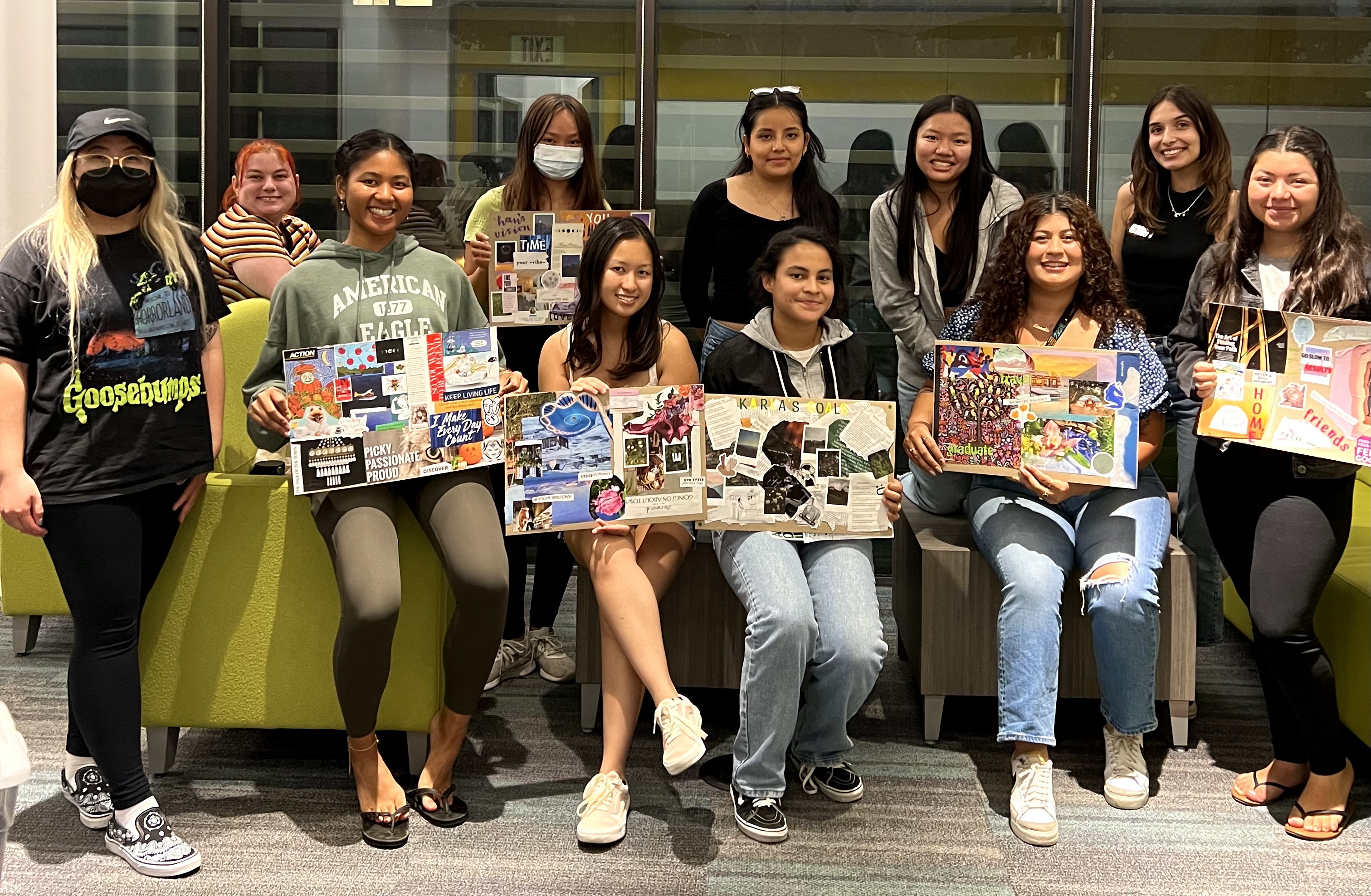 The Womxn's Collective holding their vision boards during the September Heart to Heart