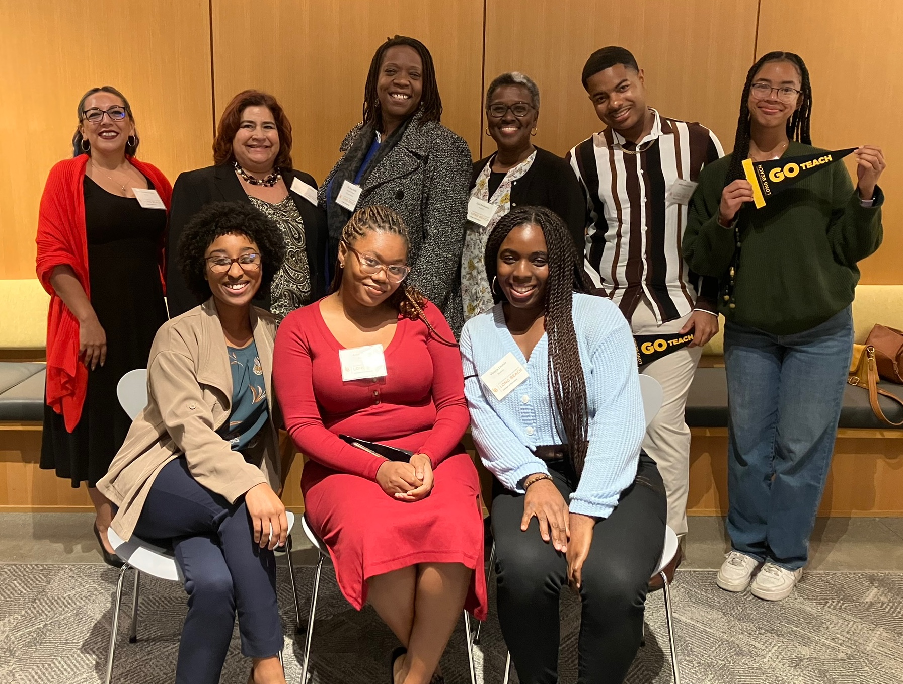 Students and administrators in the Teachers for Urban Schools program pose for a group photo.