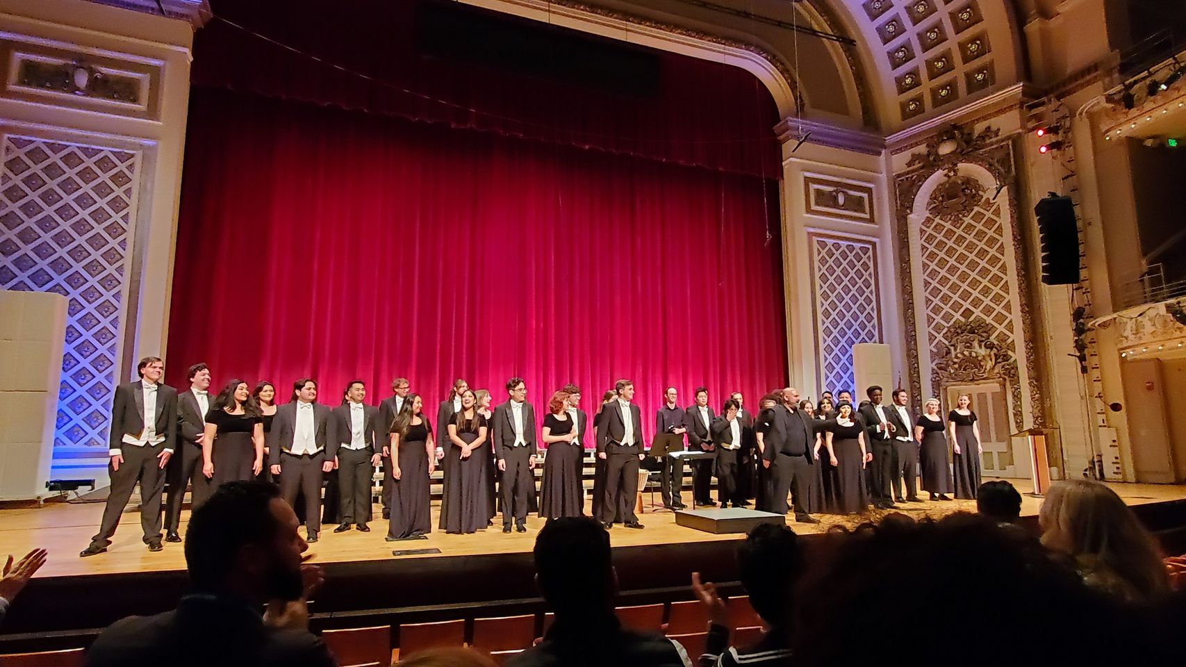 Bob Cole Chamber Choir onstage at the American Choral Directors Conference during their performance