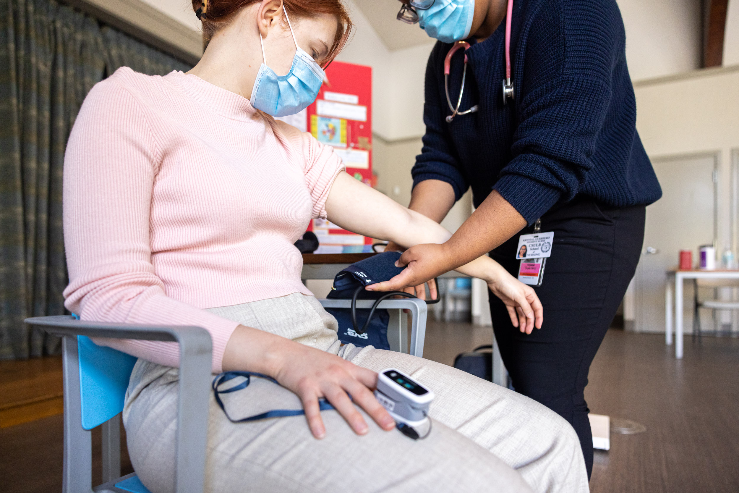 student nurse takes blood pressure